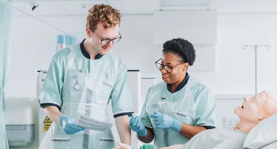 Nursing students with manekin and sample